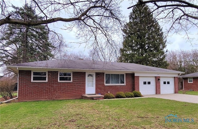 354 N River Rd, Waterville, OH 43566 - single story home with driveway, a front yard, a garage, and brick siding