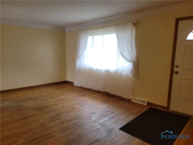 354 N River Rd, Waterville, OH 43566 - entryway with baseboards, visible vents, crown molding, and wood finished floors