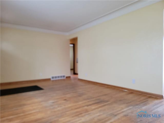 354 N River Rd, Waterville, OH 43566 - unfurnished room featuring light wood finished floors, baseboards, and visible vents