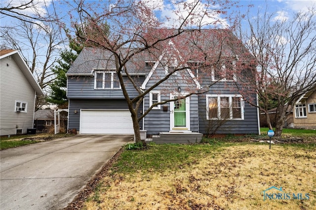 view of front facade with driveway and a garage