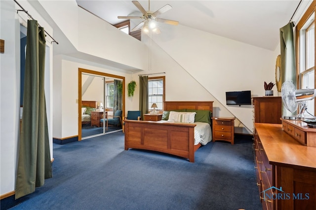 bedroom featuring a ceiling fan, high vaulted ceiling, dark carpet, and baseboards