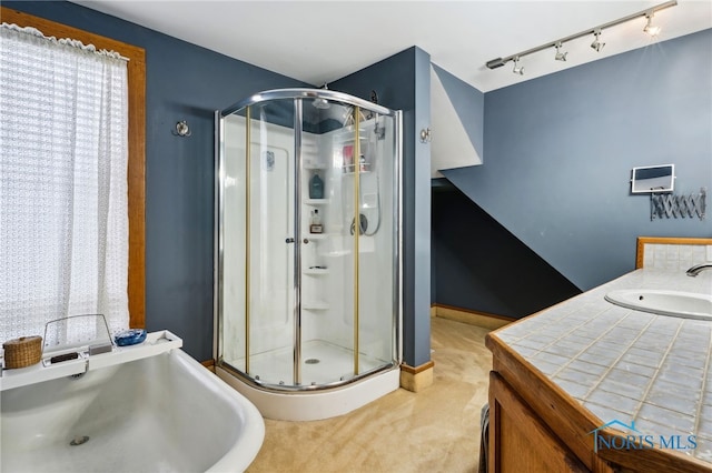 full bath featuring a sink and a stall shower