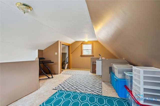 bonus room featuring vaulted ceiling