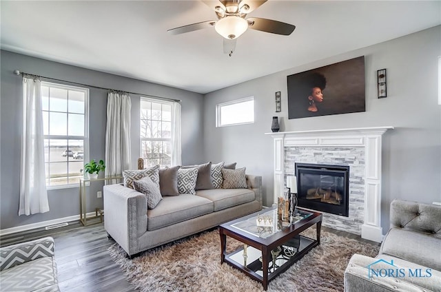 100 Bentley Dr, Perrysburg, OH 43551 - living area featuring baseboards, a fireplace, dark wood-type flooring, and a ceiling fan