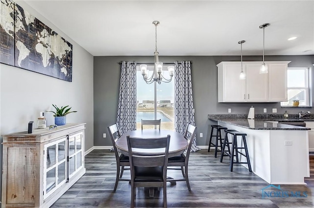 100 Bentley Dr, Perrysburg, OH 43551 - dining space with plenty of natural light, a notable chandelier, and dark wood-style flooring