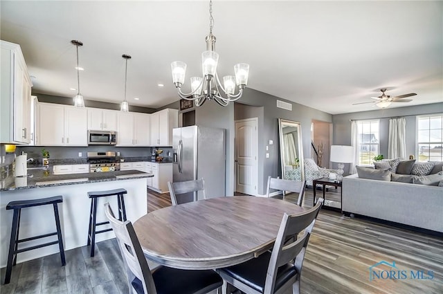 100 Bentley Dr, Perrysburg, OH 43551 - dining area featuring ceiling fan with notable chandelier, visible vents, recessed lighting, and dark wood-type flooring