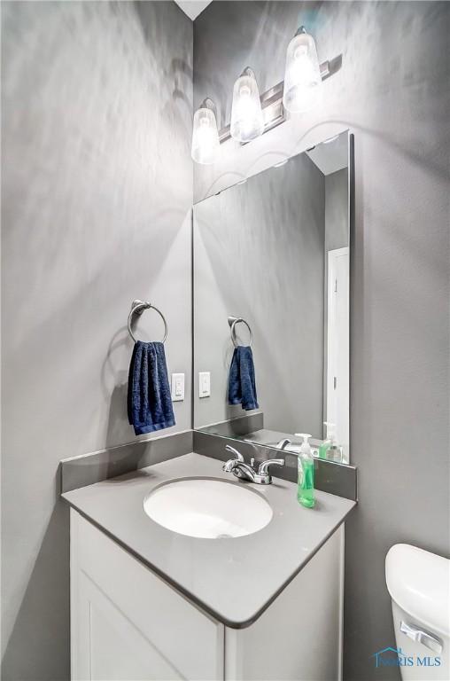 100 Bentley Dr, Perrysburg, OH 43551 - half bathroom featuring toilet and vanity