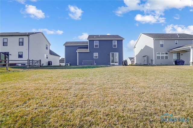 100 Bentley Dr, Perrysburg, OH 43551 - back of house featuring a lawn