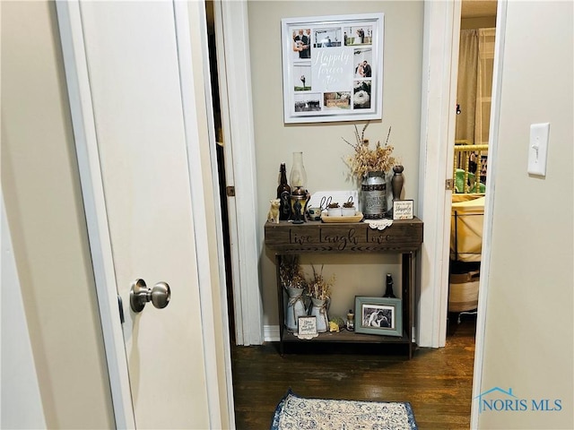 hallway with wood finished floors