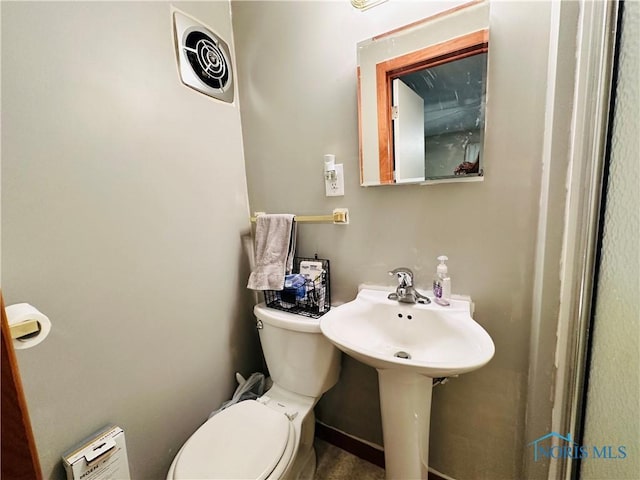 bathroom featuring visible vents and toilet
