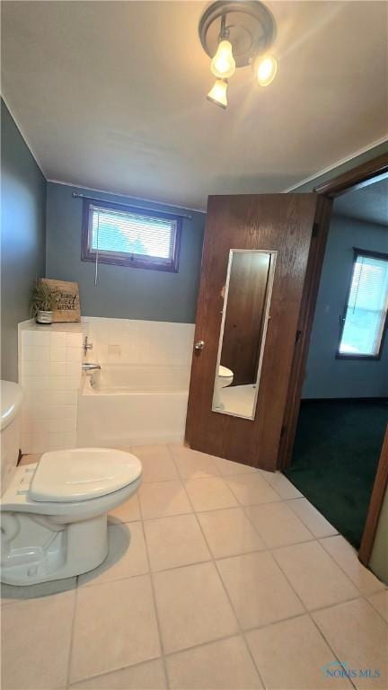 16325 Road 25P, Ottoville, OH 45844 - bathroom featuring toilet, healthy amount of natural light, tile patterned floors, and a bath