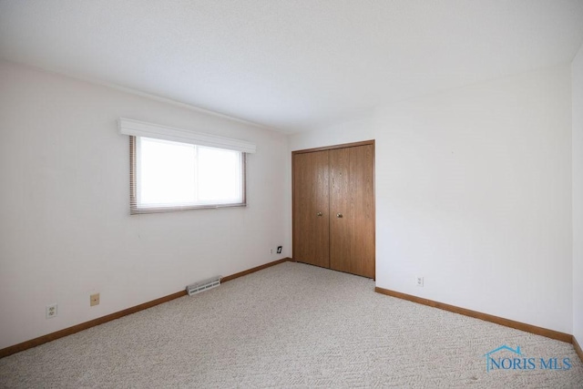 5644 Greenridge Dr Unit 5644, Toledo, OH 43615 - unfurnished bedroom featuring a closet and light carpet