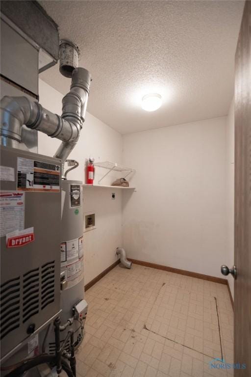 5644 Greenridge Dr Unit 5644, Toledo, OH 43615 - laundry room featuring hookup for an electric dryer, water heater, and a textured ceiling