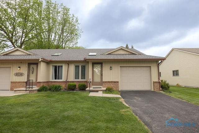 5644 Greenridge Dr Unit 5644, Toledo, OH 43615 - ranch-style house featuring brick siding, driveway, a front lawn, an attached garage, and a shingled roof