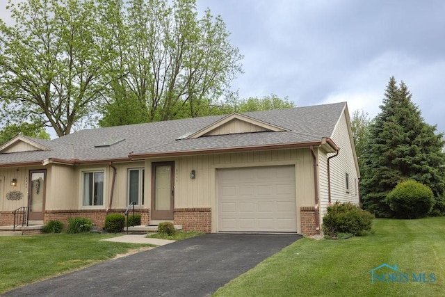 5644 Greenridge Dr Unit 5644, Toledo, OH 43615 - single story home featuring brick siding, a shingled roof, a garage, and driveway