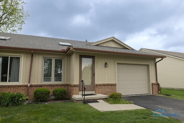 5644 Greenridge Dr Unit 5644, Toledo, OH 43615 - ranch-style home featuring brick siding, board and batten siding, driveway, a front yard, and roof with shingles