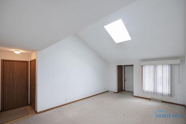 5644 Greenridge Dr Unit 5644, Toledo, OH 43615 - empty room with a skylight, vaulted ceiling, and carpet