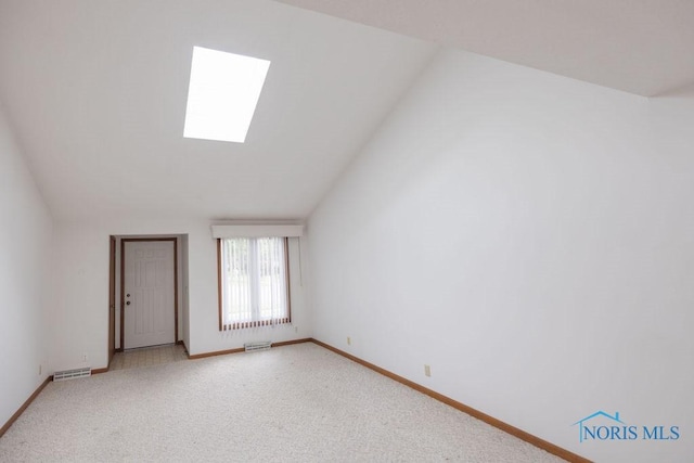 5644 Greenridge Dr Unit 5644, Toledo, OH 43615 - empty room with a skylight, light carpet, and lofted ceiling