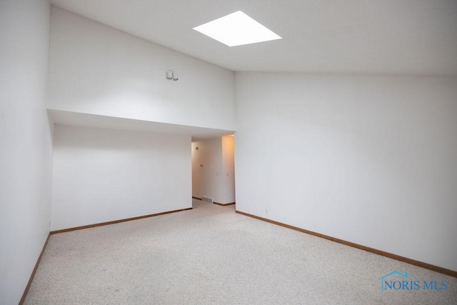 5644 Greenridge Dr Unit 5644, Toledo, OH 43615 - spare room with vaulted ceiling, light colored carpet, and a skylight