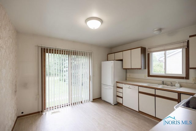 5644 Greenridge Dr Unit 5644, Toledo, OH 43615 - kitchen with white appliances, light wood-style flooring, and light countertops