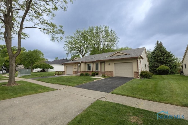 5644 Greenridge Dr Unit 5644, Toledo, OH 43615 - ranch-style house featuring an attached garage, driveway, brick siding, a front yard, and roof with shingles