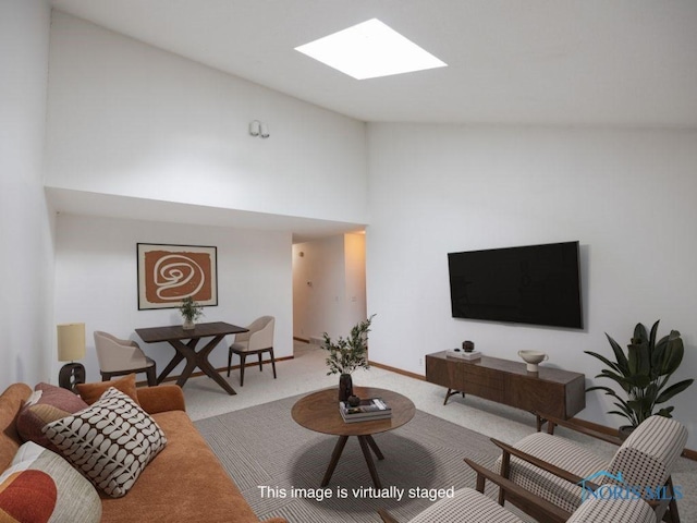5644 Greenridge Dr Unit 5644, Toledo, OH 43615 - carpeted living room with a skylight and high vaulted ceiling