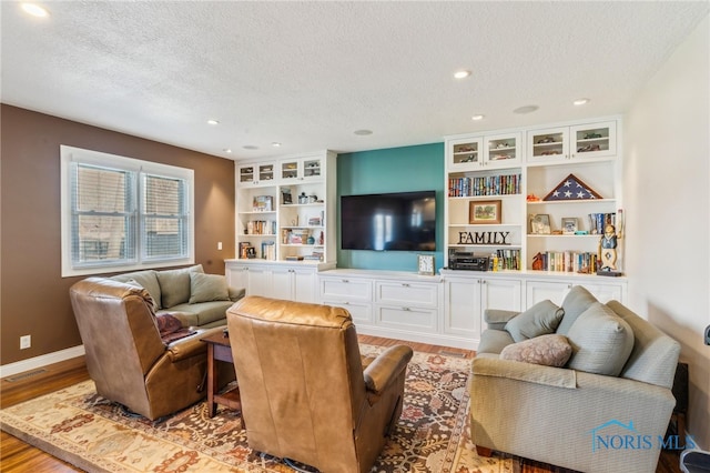 3114 Gleneagle Dr, Findlay, OH 45840 - living room with recessed lighting, baseboards, a textured ceiling, and wood finished floors
