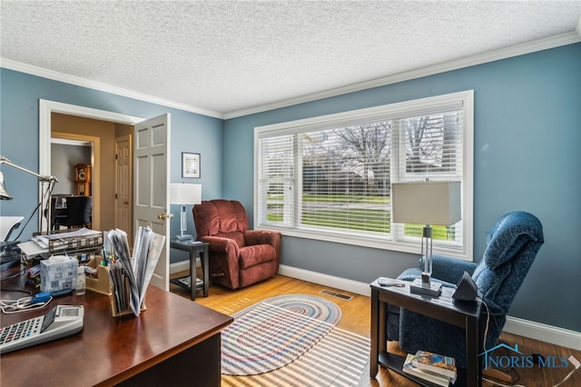 3114 Gleneagle Dr, Findlay, OH 45840 - home office with crown molding, a textured ceiling, baseboards, wood finished floors, and visible vents