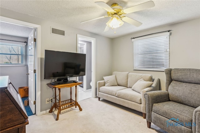 3114 Gleneagle Dr, Findlay, OH 45840 - living area with carpet floors, a ceiling fan, a textured ceiling, and visible vents