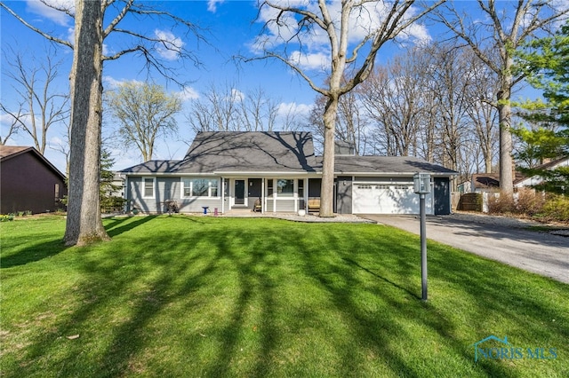 3114 Gleneagle Dr, Findlay, OH 45840 - ranch-style home with a garage, covered porch, a front yard, a chimney, and driveway