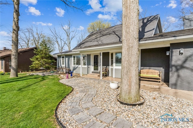 3114 Gleneagle Dr, Findlay, OH 45840 - back of property with a lawn, a chimney, and roof with shingles