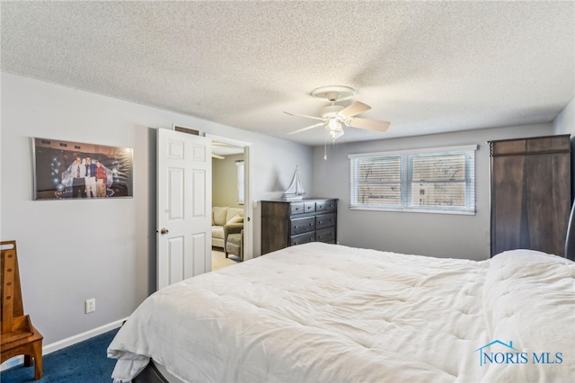 3114 Gleneagle Dr, Findlay, OH 45840 - carpeted bedroom featuring a textured ceiling, baseboards, visible vents, and a ceiling fan