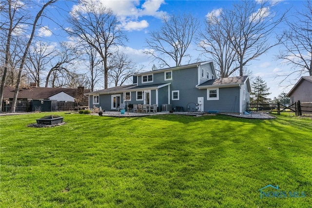3114 Gleneagle Dr, Findlay, OH 45840 - back of house with a fenced backyard, a yard, a fire pit, and central AC