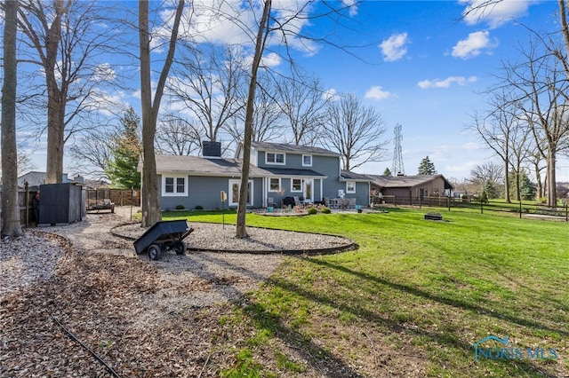 3114 Gleneagle Dr, Findlay, OH 45840 - back of house featuring a fenced backyard, a patio area, a yard, and a chimney