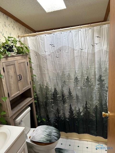 bathroom with vanity, crown molding, toilet, a textured ceiling, and wallpapered walls