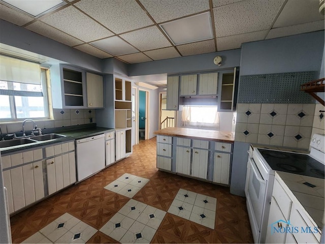 825 Park St, Findlay, OH 45840 - kitchen featuring a sink, open shelves, tasteful backsplash, white appliances, and a drop ceiling