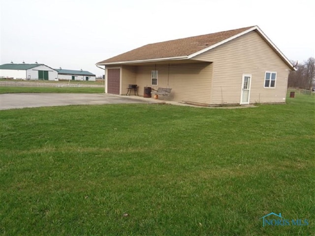 13837 Rd 12, Ottawa, OH 45875 - view of home's exterior featuring driveway and a lawn