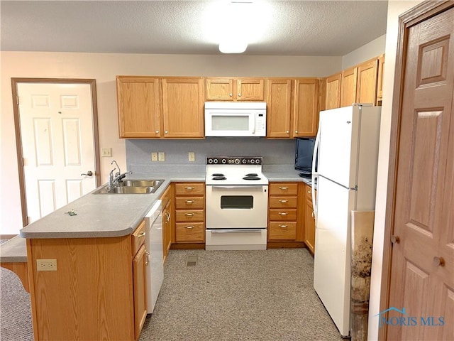 12783 Rd 82 Unit 1, Paulding, OH 45879 - kitchen featuring a textured ceiling, light countertops, a peninsula, white appliances, and a sink