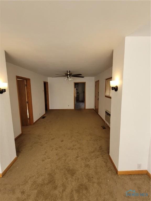 621 Nevada St, Toledo, OH 43605 - unfurnished living room featuring light carpet, baseboards, and ceiling fan