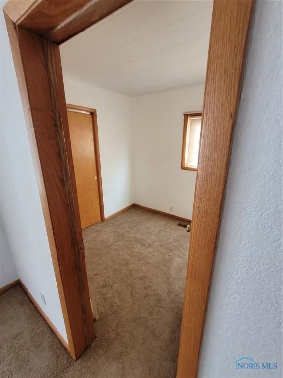 621 Nevada St, Toledo, OH 43605 - carpeted empty room with baseboards