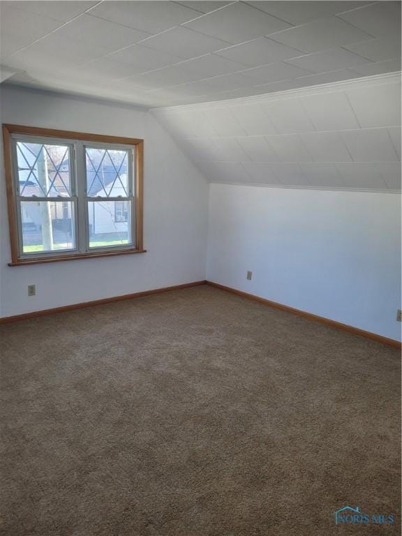 621 Nevada St, Toledo, OH 43605 - bonus room with baseboards, lofted ceiling, and carpet flooring