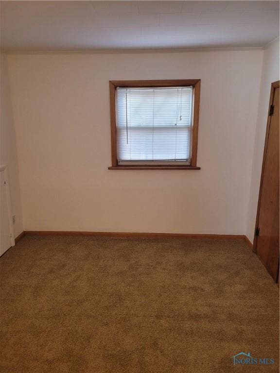 621 Nevada St, Toledo, OH 43605 - carpeted empty room with crown molding and baseboards