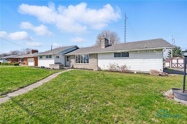 284 E Findlay St, Sugar Creek Township, OH 45893 - rear view of house with a storage unit, a chimney, an outdoor structure, and a yard