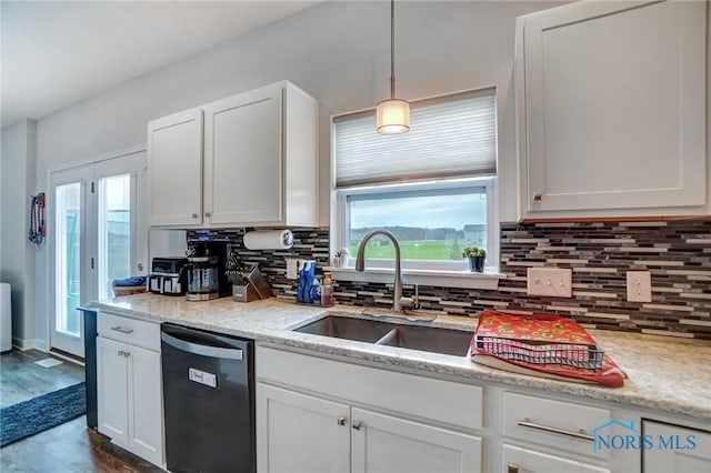kitchen featuring a sink, white cabinets, and dishwasher