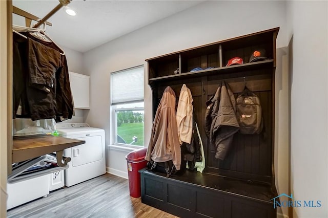mudroom featuring baseboards, light wood-style floors, washer and dryer, and recessed lighting