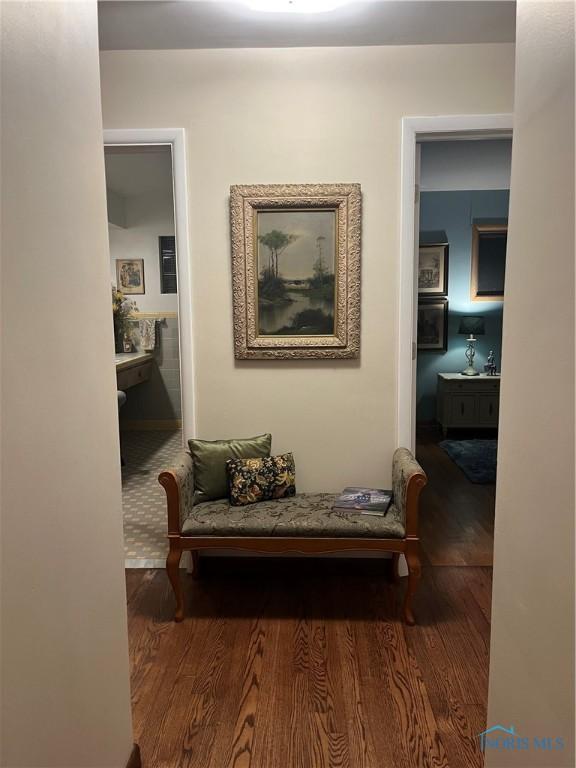 corridor featuring wood finished floors