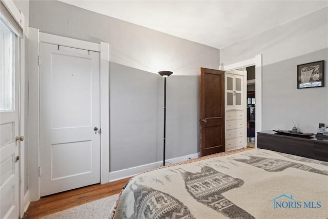 bedroom with wood finished floors