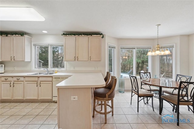 2016 Austin Bluffs Ct, Toledo, OH 43615 - kitchen with a wealth of natural light, light tile patterned floors, white appliances, and a sink