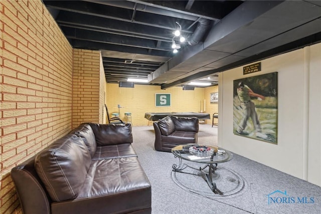 2016 Austin Bluffs Ct, Toledo, OH 43615 - carpeted living area with brick wall