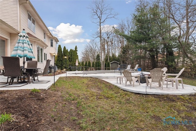 2016 Austin Bluffs Ct, Toledo, OH 43615 - view of yard featuring an outbuilding, fence, and a patio